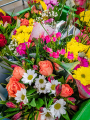 Bouquets of flowers in the supermarket . Ready-made bouquets. Flowers on the occasion. Beautiful bright flowers.