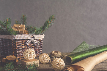 Christmas and zero waste, eco friendly packaging gifts in kraft paper on a wooden table, eco...