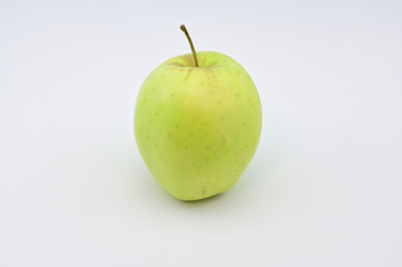 Photo of a juicy ripe green apple with vitamins on a white background. Healthy food concept.