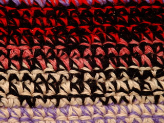Fototapeta premium the texture of the knitted fabric is a thick multi-colored thread