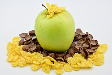 Photo of a juicy ripe green apple with oatmeal on a white background. Healthy food concept.