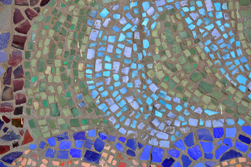 Mosaic pattern of multicolored tiles on the wall