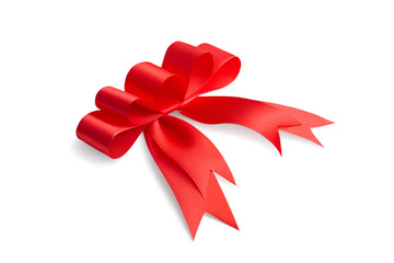 Side view of an unusual creative handmade beautiful holiday gift bow made of red satin shiny bright ribbon with five loops isolated on white background