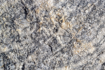 the structure of the stone, such as basalt or granite 