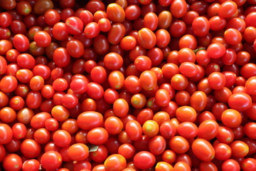 Delicious red tomatoes. Summer tray market agriculture farm full of organic vegetables It can be used as background.
