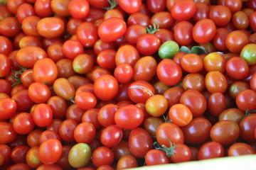 Delicious red tomatoes. Summer tray market agriculture farm full of organic vegetables It can be used as background.