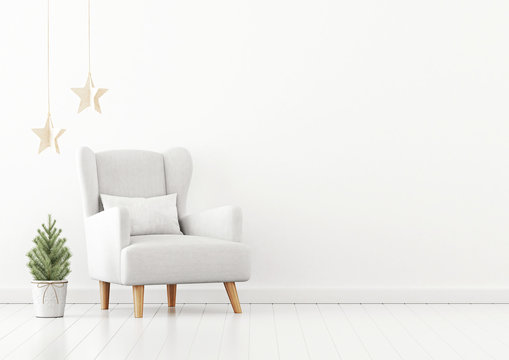 Living room interior wall mockup with white armchair, pillow, christmas tree and star garland on empty white background. 3D rendering, illustration.