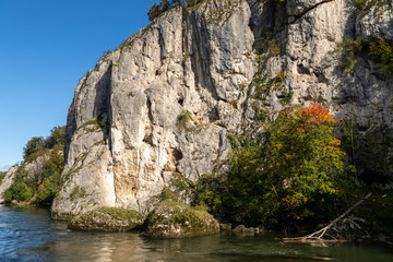 Danube river near Danube breakthrough near Kelheim, Bavaria, Germany in autumn with limestone rock...