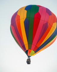 Fototapeta premium Rainbow Colored Balloon against Clear Sky