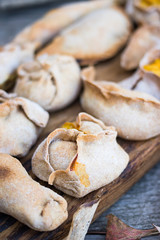 Baked and fried momos, ravioli, dumplings, pierogi,  khinkali, samosa with lentil and pumpkin...