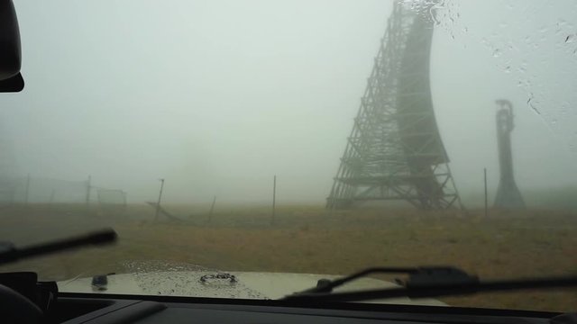 Driving up to White Alice antenna array on a storm day. A cold war abandoned military complex in Nome, Alaska.