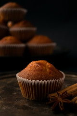 muffin with anise on dark background