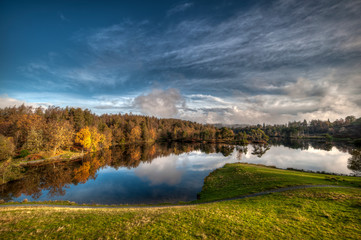 Fototapeta na wymiar .Stunning landscape image of Tarn Hows in Lake District during beautiful Autumn Fall.