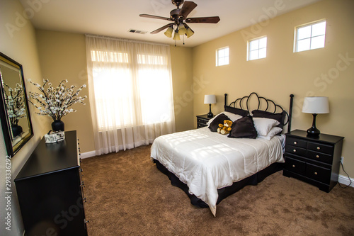 Black Dresser Nightstands And Lamps In Modern Bedroom Stock