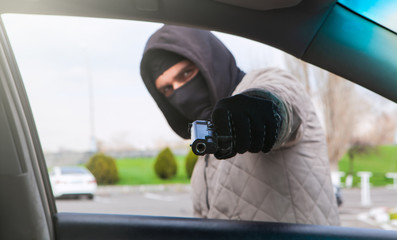 criminal robbing a car driver; social issue