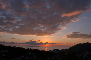 Colorful sunset with clouds over the city