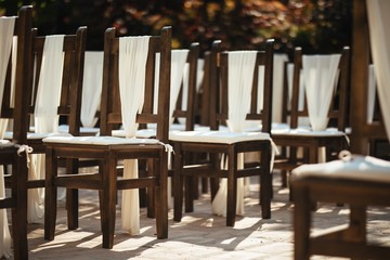 Decorated chairs at wedding venue.