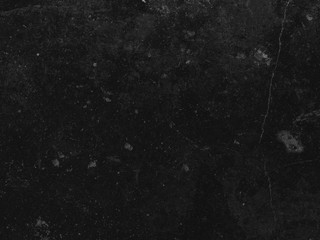 Dark gray industrial wall background with cracks and scratches.
