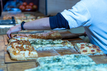 Pizza maker hands preparing the market