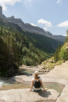 Rear view of woman enjoying the view in the mountains, Ordesa national park, Aragon, Spain