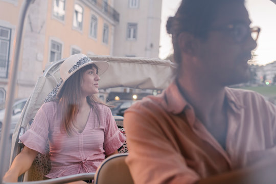 Tuk tuk driver providing tour of the city to a tourist, Lisbon, Portugal