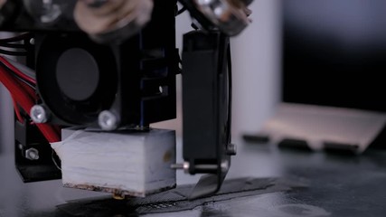 Three dimensional printing machine printing 3D plastic model at modern technology exhibition. 4.0 industrial revolution, additive manufacturing, 3D printing and robotic automation technology concept