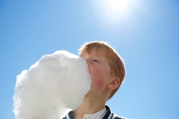 Boy eating cotton candy
