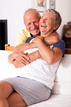 Portrait of happy senior couple together at home