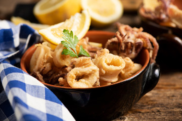 Traditional Italian fried calamari and lemon slice
