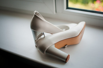 White woman shoes on the windowsill