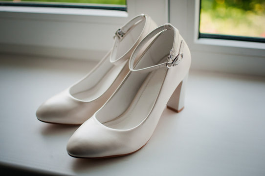White woman shoes on the windowsill