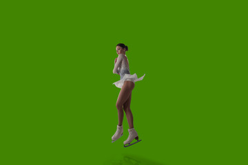 Fototapeta na wymiar Figure skating girl isolated on green background.