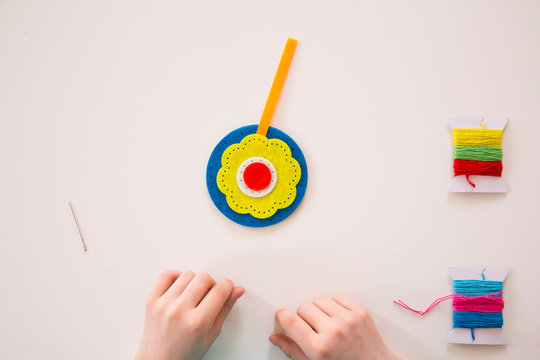 Girl embroidering, felt, decoration