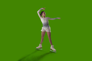 Figure skating girl isolated on green background. © Victoria VIAR PRO