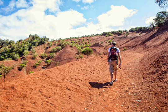 Hiker on red soil, Agulo, La Gomera, Canary Islands, Spain