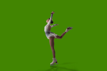 Figure skating girl isolated on green background.