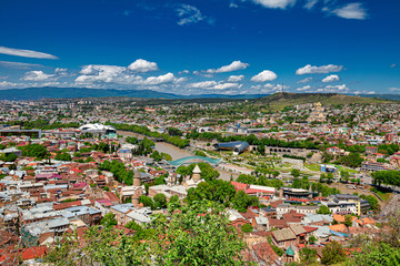 Tbilisi, Georgia - May 9, 2017. Panorama of the central part of the ancient city and the main attractions of the capital of Georgia. Sunny day, blue sky with clouds. - 298346419