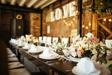 Decorated dining table at wedding venue.