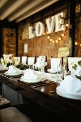 Dining table setting at wedding reception.