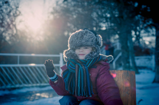 Smiling boy outdoors in winter, portrait
