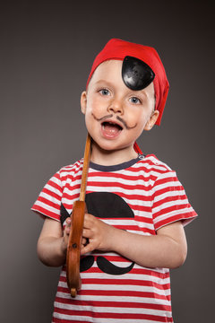 Portrait of little boy dressed as pirate