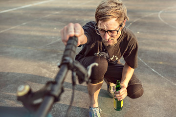 Germany, Hannover, Bike polo player checking bike