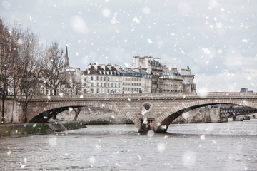 Seine River, bridges, Paris in gloomy winter day