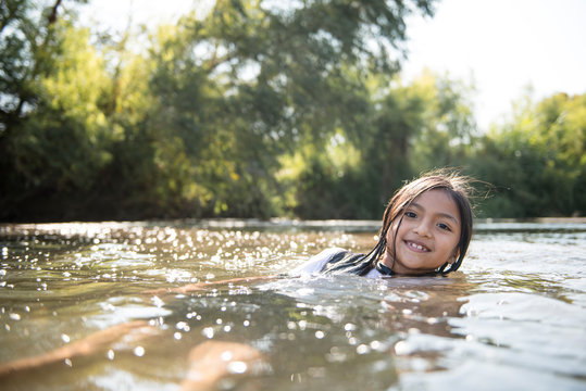 Girl enjoying a summer day on the river