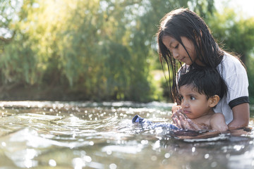 Boy and girl calm on the river