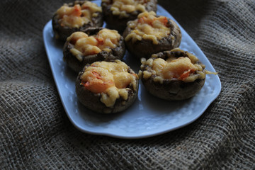 Baked mushrooms on a white plate