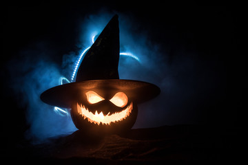 Halloween pumpkin smile and scary eyes for party night. Close up view of scary Halloween pumpkin...