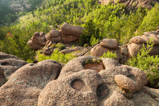 Granite rock formations with eroded potholes in Lost Creek Wilderness