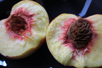 The peach is cut in half