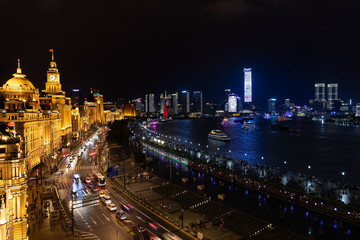 Fototapeta na wymiar Shanghai China city centre skyline evening view combining old and new town buildings on the Bund boulevard promenade